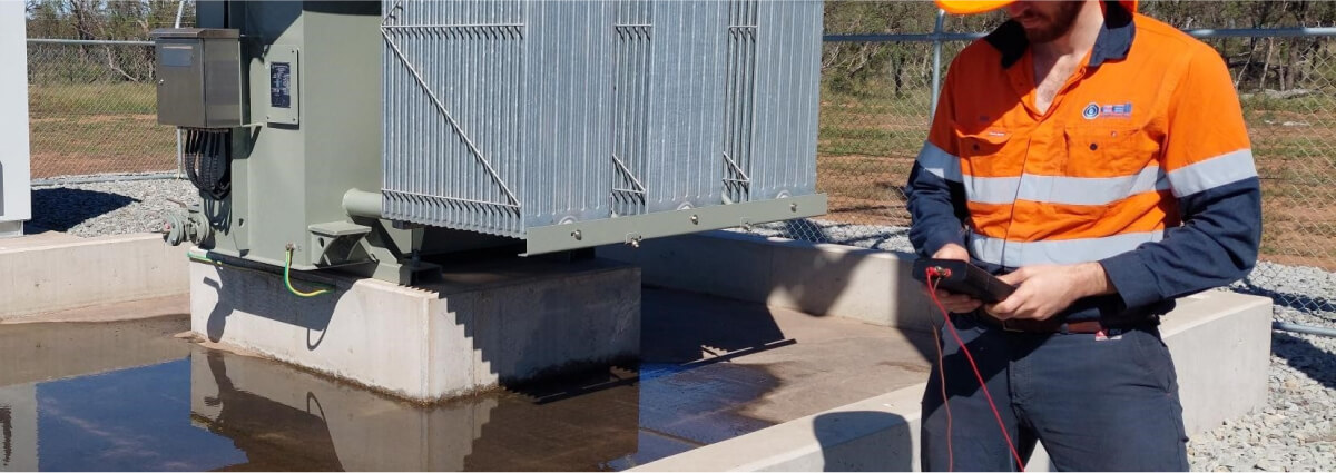 A safety inspector in protective gear reviewing documents and examining industrial equipment, illustrating the importance of safety protocols and inspections