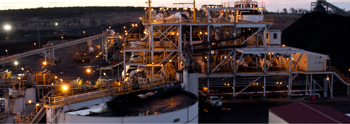 Images showing industrial facilities with extensive machinery and infrastructure, illustrating the complexity and scale of operations in hazardous area designs